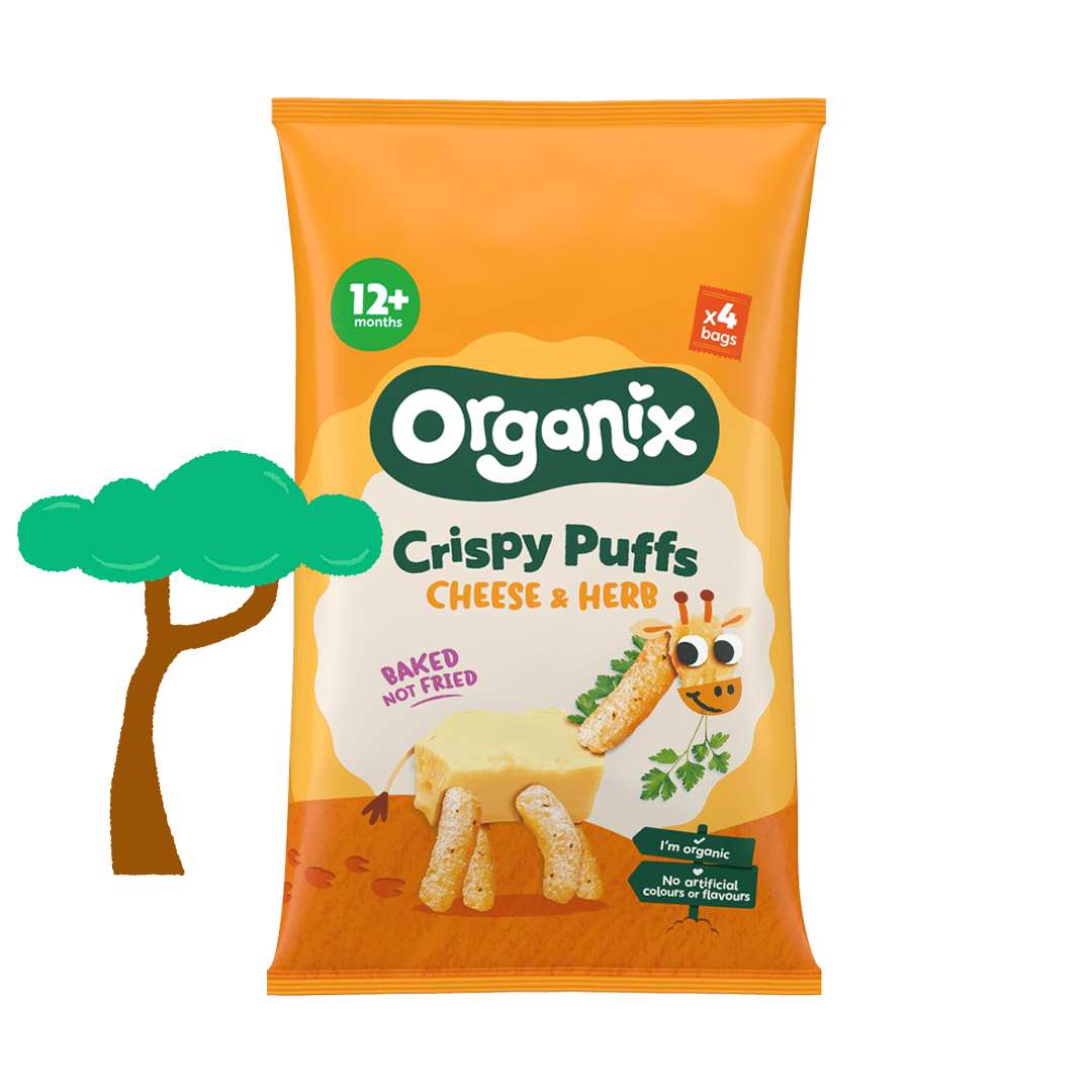 A rectangular yellow and orange pack of Organix Crispy cheese and herb puffs, cartoon giraffe made from blocks of cheese and the puffs is on the front. There is a green illustrated tree on the left hand side of the box.